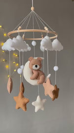 Load and play video in Gallery viewer, Beige , brown baby mobile with sleeping bear, Baby bear nursery mobile, Moon, stars and clouds crib mobile, Boho nursery mobile, Animals
